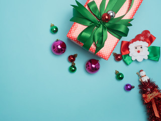 Christmas decoration  on color background . Red and gift box and decorate ball  .top  view composition.