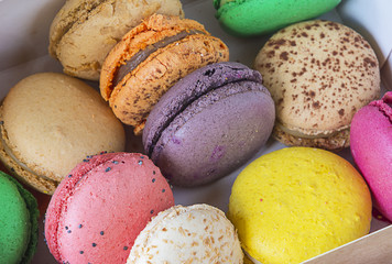Traditional multicolor french macaroons in the box