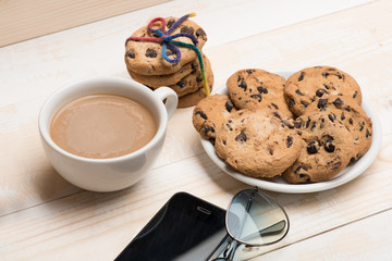 Cup of coffee with cookies