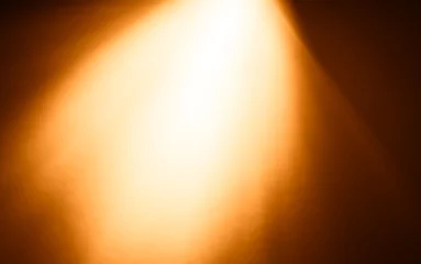 Abwaschbare Fototapete Licht und Schatten Top orange ray of light bokeh background