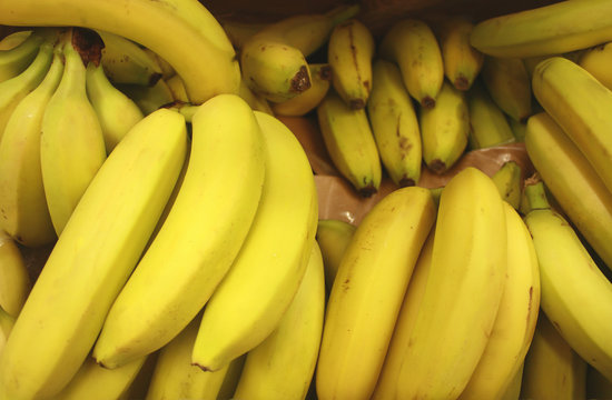 Bunch of ripened bananas at grocery store, closeup