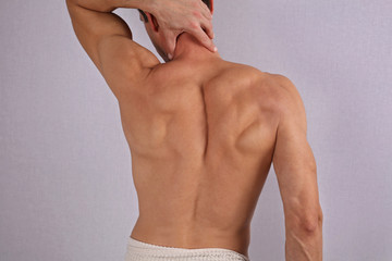 Male Waxing. Muscular male back, torso, chest and armpit hair removal.