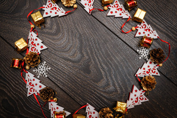 frame from Christmas toys on wooden background