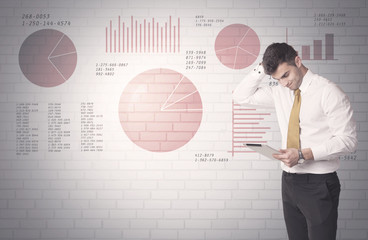 Pie charts and numbers on wall with salesman