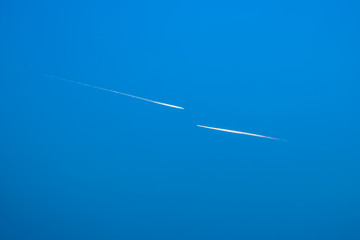 Two airplanes flying in blue sky