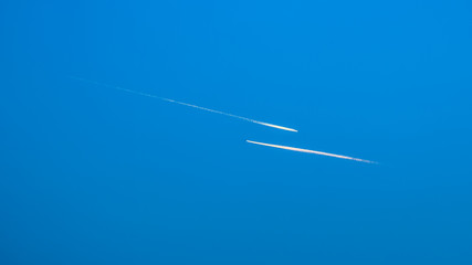 Two airplanes flying in blue sky © k_samurkas