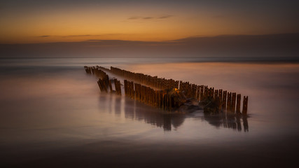 Obraz premium Night, wave breaker in the black sea, Poti, Georgia