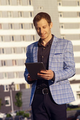 smiling man with a clipboard in his hands,standing and chatting
