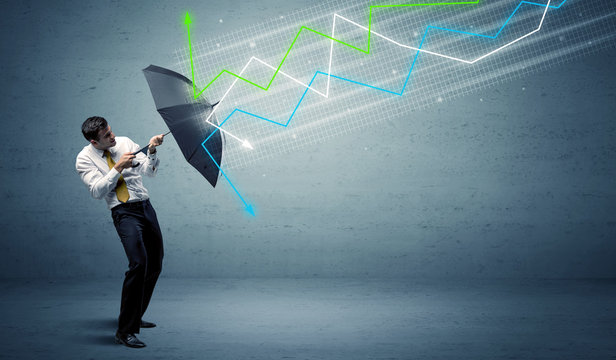 Business person with umbrella and stock market arrows concept