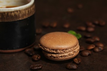 French macarons on dark moody background, shallow depth of field
