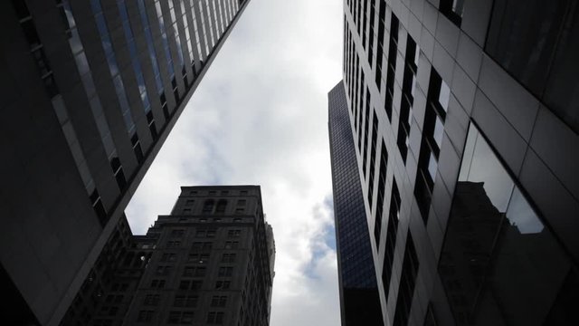 Sky clouds seen thru skyscrapers in NYC New York City Manhattan 