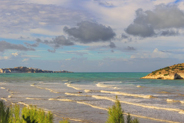  Summertime relax.The most beautiful coasts of Italy: bay of Vieste.-(Apulia, Gargano) -In the...