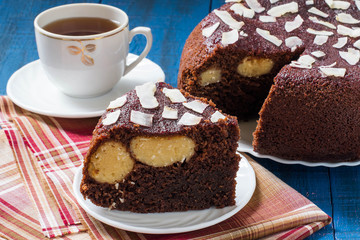 Homemade chocolate cake with curd-coconut balls
