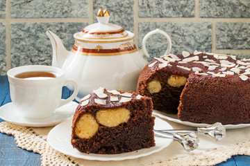 Homemade chocolate cake with curd-coconut balls