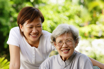 Two women, smiling at camera