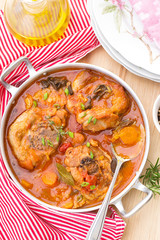 Turkey ossobuco osso buco in tomato gravy with mushrooms