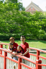 Fototapeta na wymiar Family with two boys on bridge
