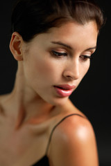 Fototapeta premium Woman looking down, head shot