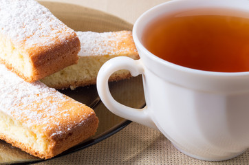 Small cup of tea and plate of cookies