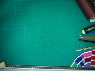 Cutting mat with various stationary tools, shot from above