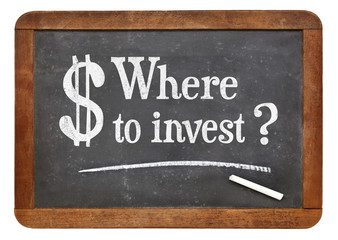 Obraz premium Where to invest question on blackboard