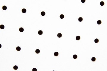 Repeating holes of white pegboard