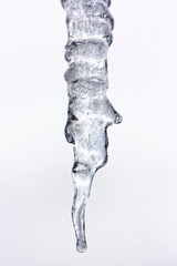 Background of bright transparent hanging down icicles. Ice texture.