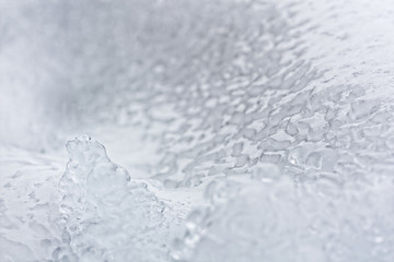 Icy crust on the snow. Close up background.