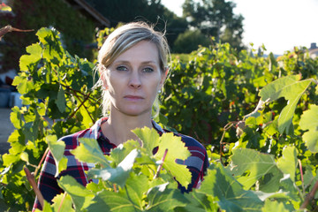female winemaker in the vineyard