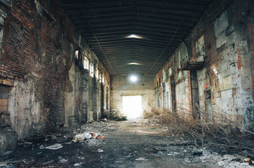 Fototapeta na wymiar Abandoned Large industrial hall of a repair station