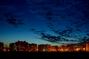 night sky with clouds over the city sunset night lights