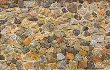 wall of granite boulders of different colors