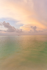 Background with pale pink sunrise sky, Maldives