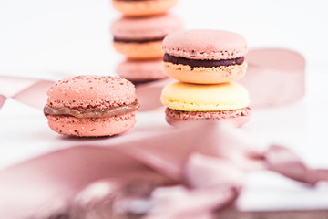 Obraz na płótnie Canvas French macarons with chocolate ganache in pastel colors