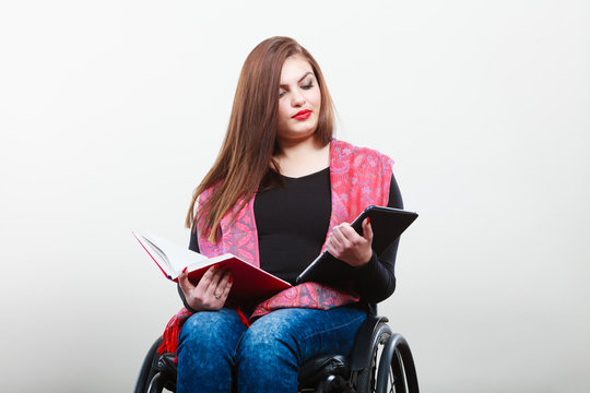 Disabled student with tablet ebook.