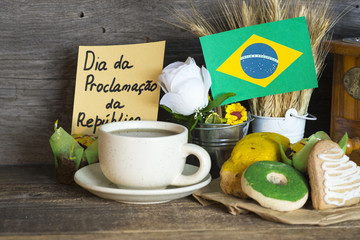 cookies with green and yellow glaze as Brazilian flag colors. cup of coffee and Flag of Brazil, decorative patriotic breakfast - The Proclamation of the Republic text