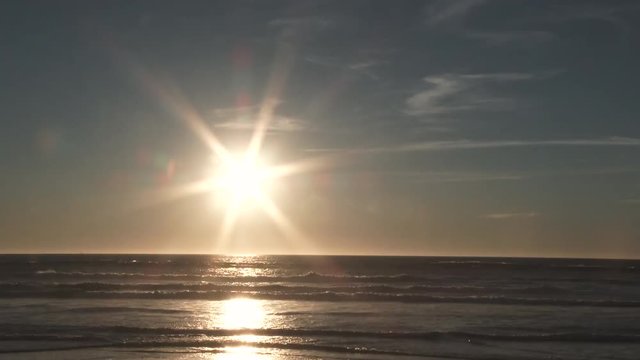 Sunset time lapse from bright day to dark night at the Pacific Ocean from the Oregon Coast on beautiful evening.