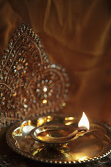 Bronze oil lamp with flame