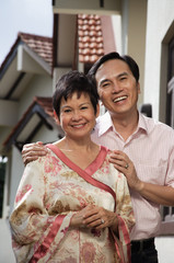 Mature couple smiling at camera