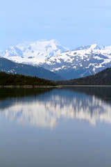 Naklejka na ściany i meble Alaska Landscape with mountains reflecting in the ocean