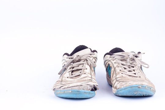 Old vintage damaged futsal sports shoes  on white background  isolated 
