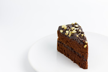 chocolate cake with almond topping on white background