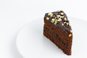 chocolate cake with almond topping on white background