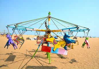 Merry Go Round at Marina Beach in Chennai City, India. Children have lot of fun activities in the beach for playing.