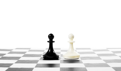 Two pawns one in front of other. Equal rivals. Concept with chess pieces against white background