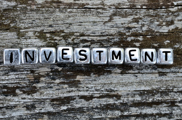 cube word investment on table