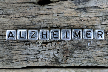 cube letter word alzheimer on wooden