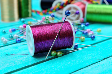 purple sewing thread on table