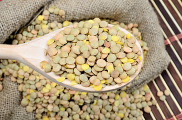 lentil in spoon on table