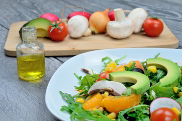 salad and vegetable with olive oil on table